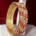 STYLE STATEMENT RUBY AD BANGLES IN GOLDEN POLISH