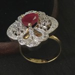 INDIAN WOMEN ENGAGMENT RING IN WHITE AD WITH RUBY SOLITAIRE