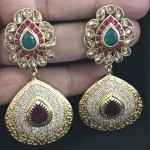 FUSION EARRING IN GOLDEN  ALLOY WITH WHITE AD AND RUBY STONE