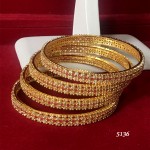 HIGH PROFILE STATEMENT CLASS BANGLE IN RUBY AND WHITE AD WITH GOLDEN POLISH 