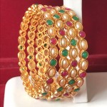 INDIAN TRADITIONAL MULTI COLOR STONE BANGLES IN GOLDEN ALLOY POLISH