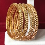 GOLDEN JALI HAND WORK WITH STUDDED PEARLS BANGLES