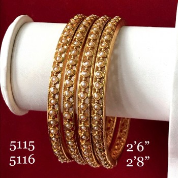 EXCLUSIVE PEARL BANGLES IN GOLDEN POLISH 