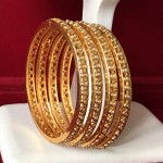 EXCLUSIVE PEARL BANGLES IN GOLDEN POLISH 