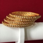 EXCLUSIVE PEARL BANGLES IN GOLDEN POLISH 