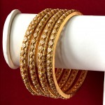 EXCLUSIVE PEARL BANGLES IN GOLDEN POLISH 