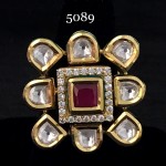 WHITE POLKI IN GOLDEN D SURROUNDING RUBY AND AD SQ RING