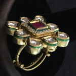 WHITE POLKI IN GOLDEN D SURROUNDING RUBY AND AD SQ RING